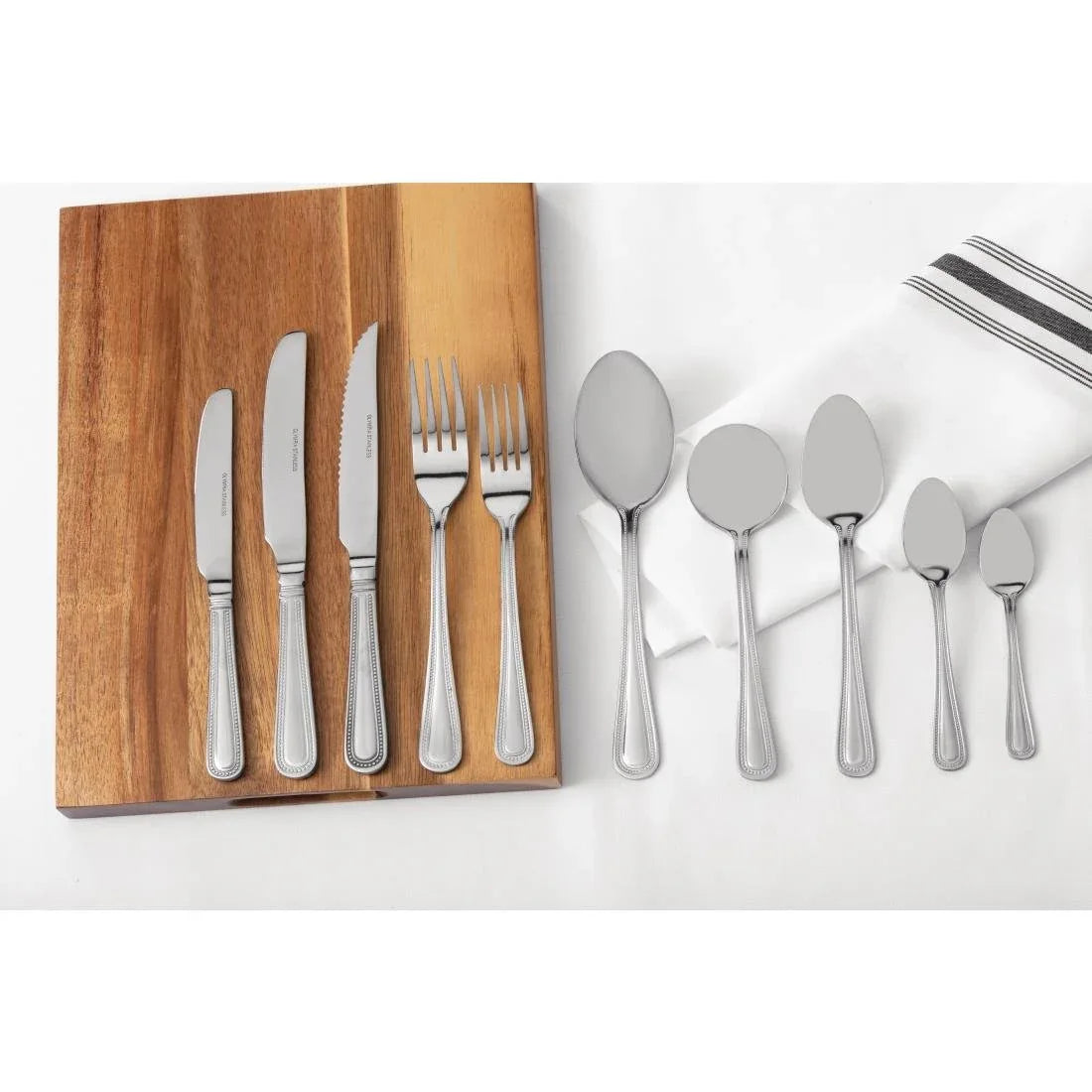 C125 Olympia Bead Solid Handle Table Knife (Pack of 12) - JD Catering Equipment Solutions Ltd